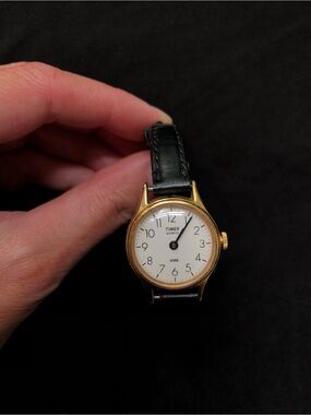 Timex Gold-Tone Wrist Watch with Black Leather Band. Womens